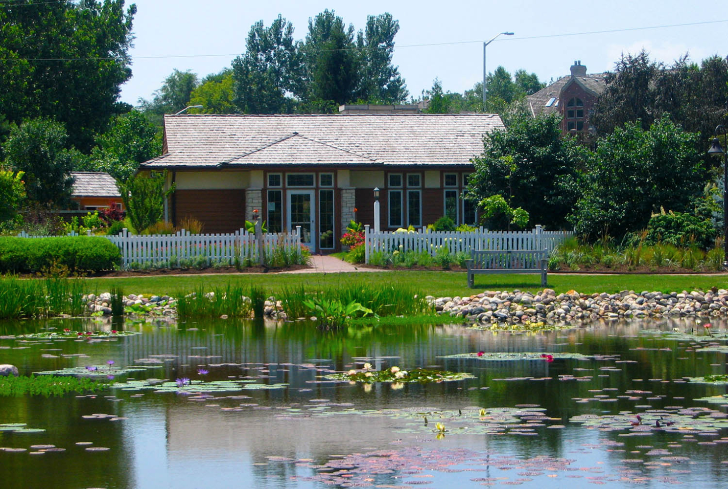 View of front of Hunziker House from across Lake Helen.