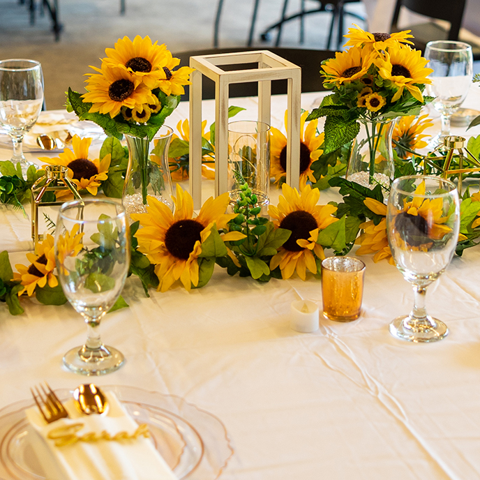 Flower centerpiece on table with glasses