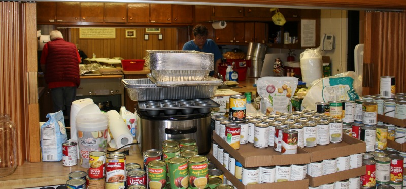 Stacks of food in a kitchen.