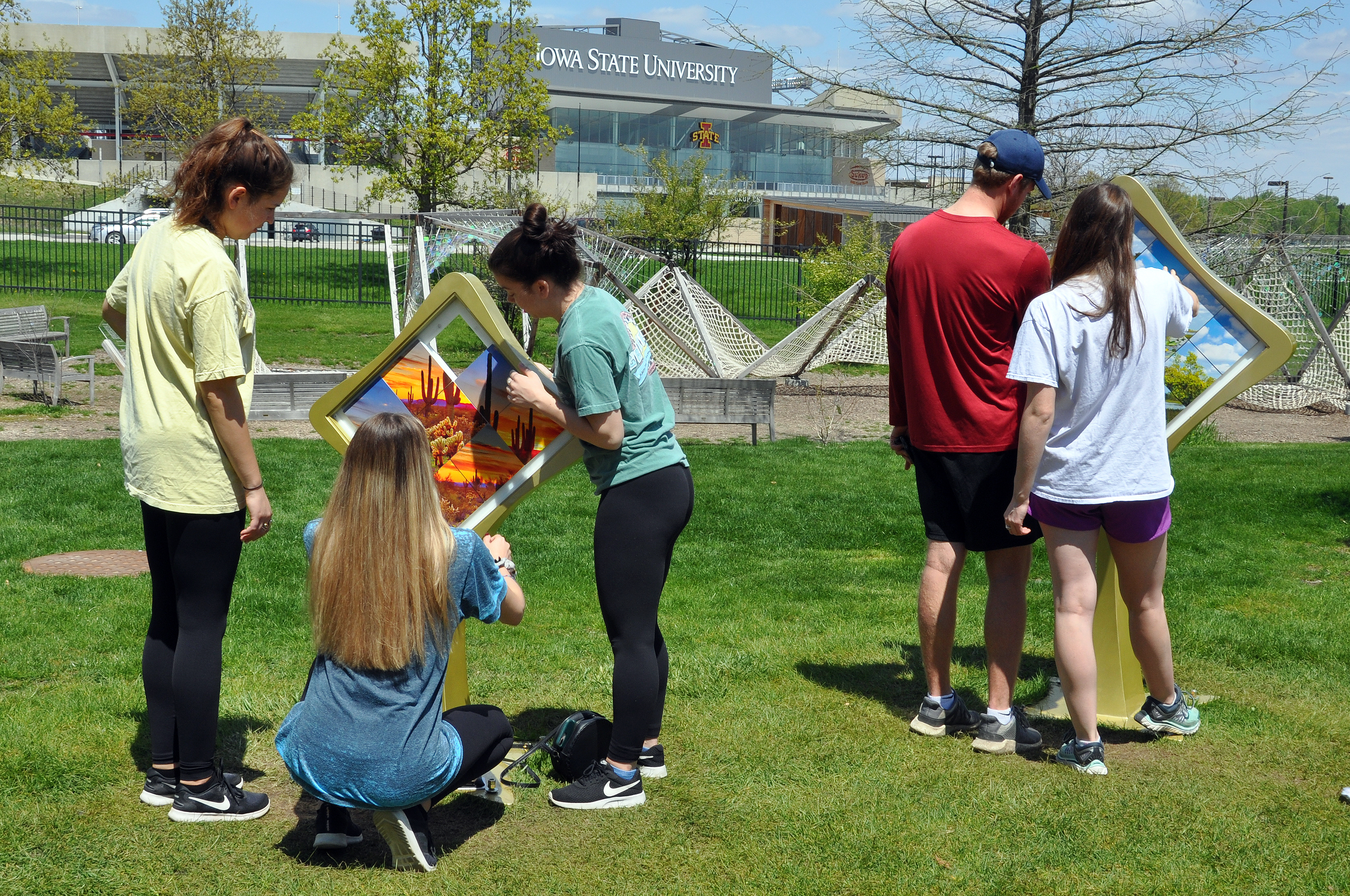 Two groups interact with two different Cause and Effect slide puzzles.