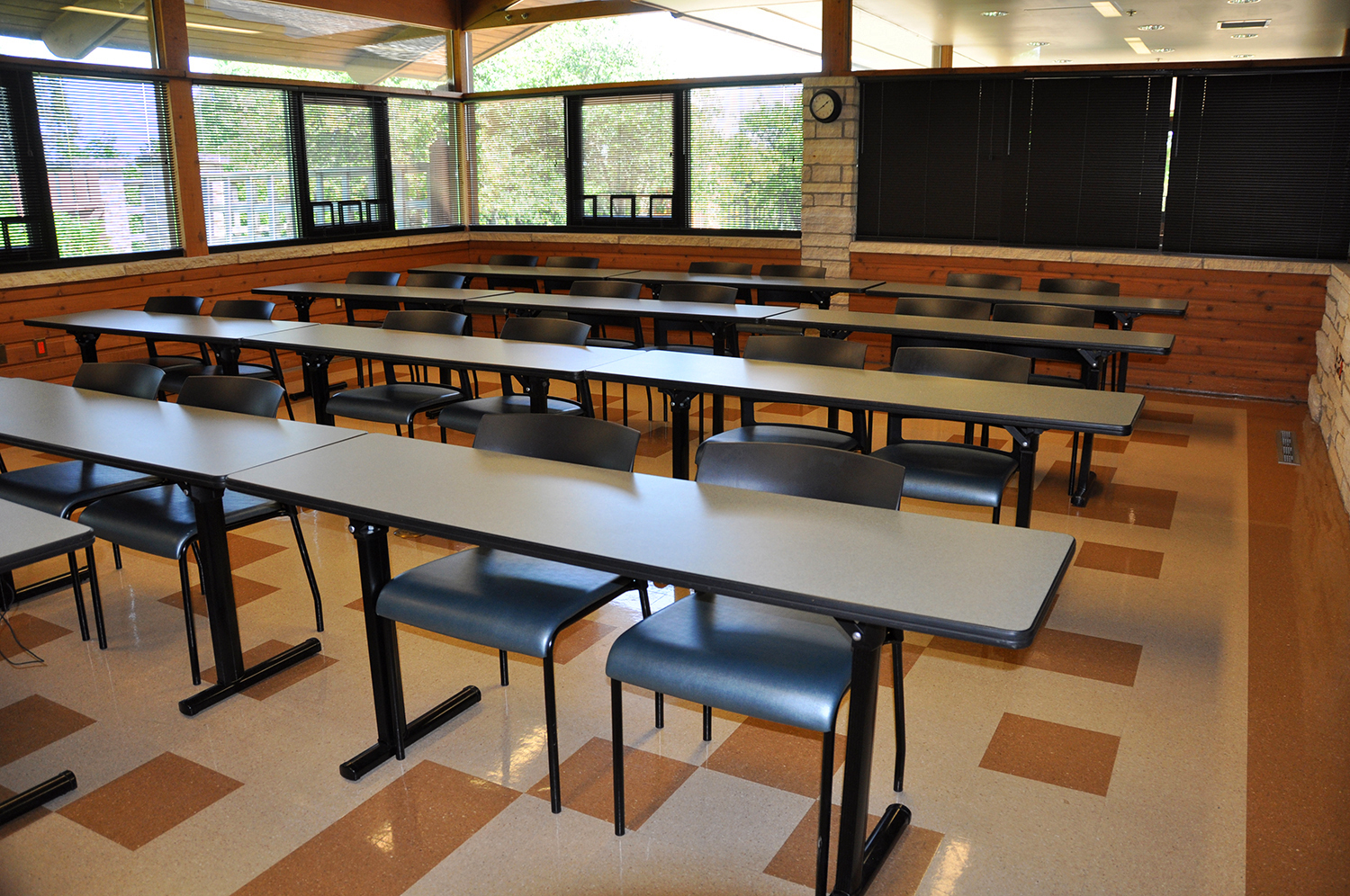  classroom rental with rows of tables and chairs
