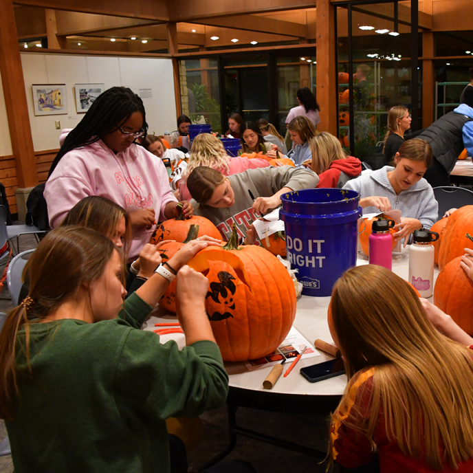 A group from a sorority stencil and carve together.