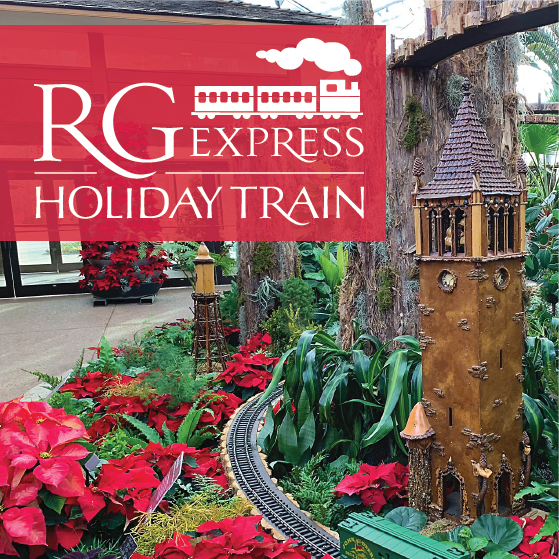 Garden scale train and minature campanile with plants