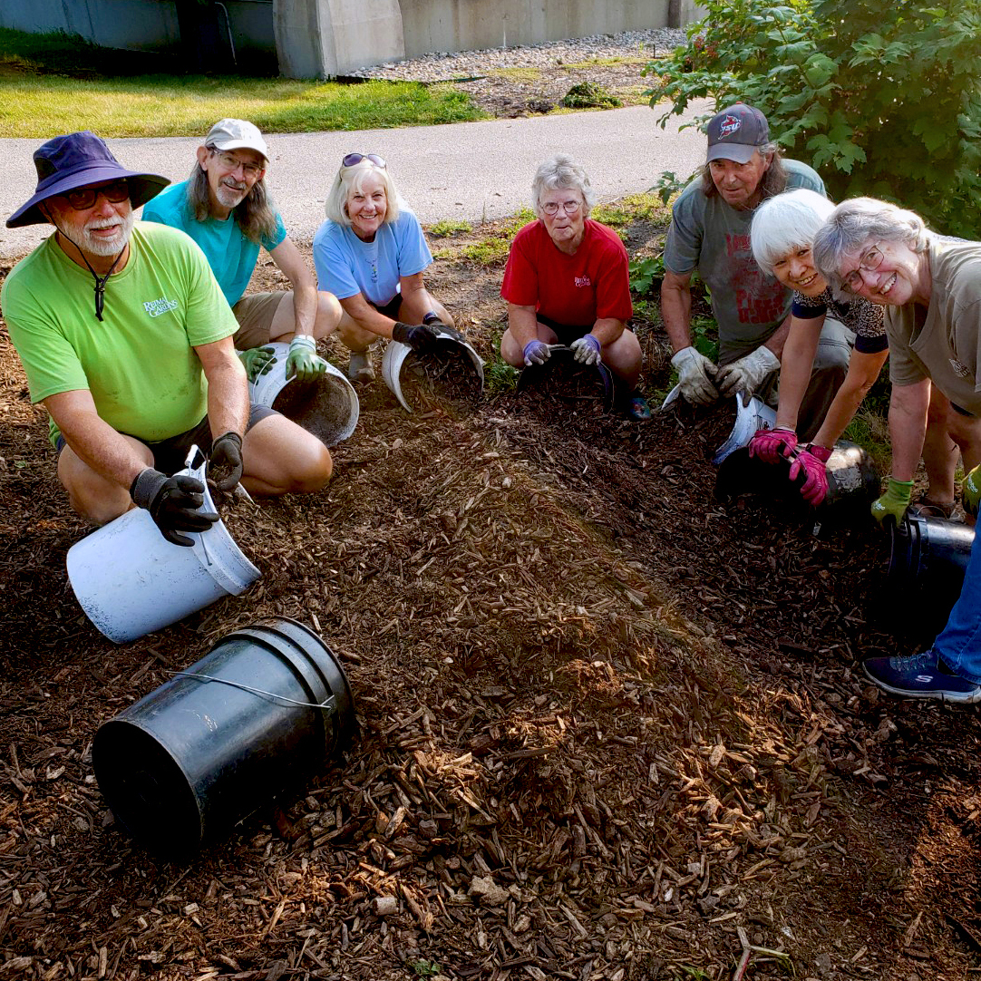 Volunteers spreading mulch