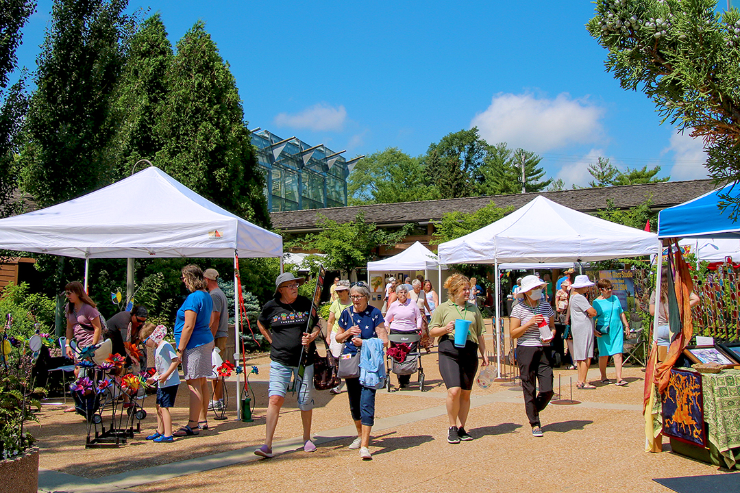 People enjoying a garden art fair