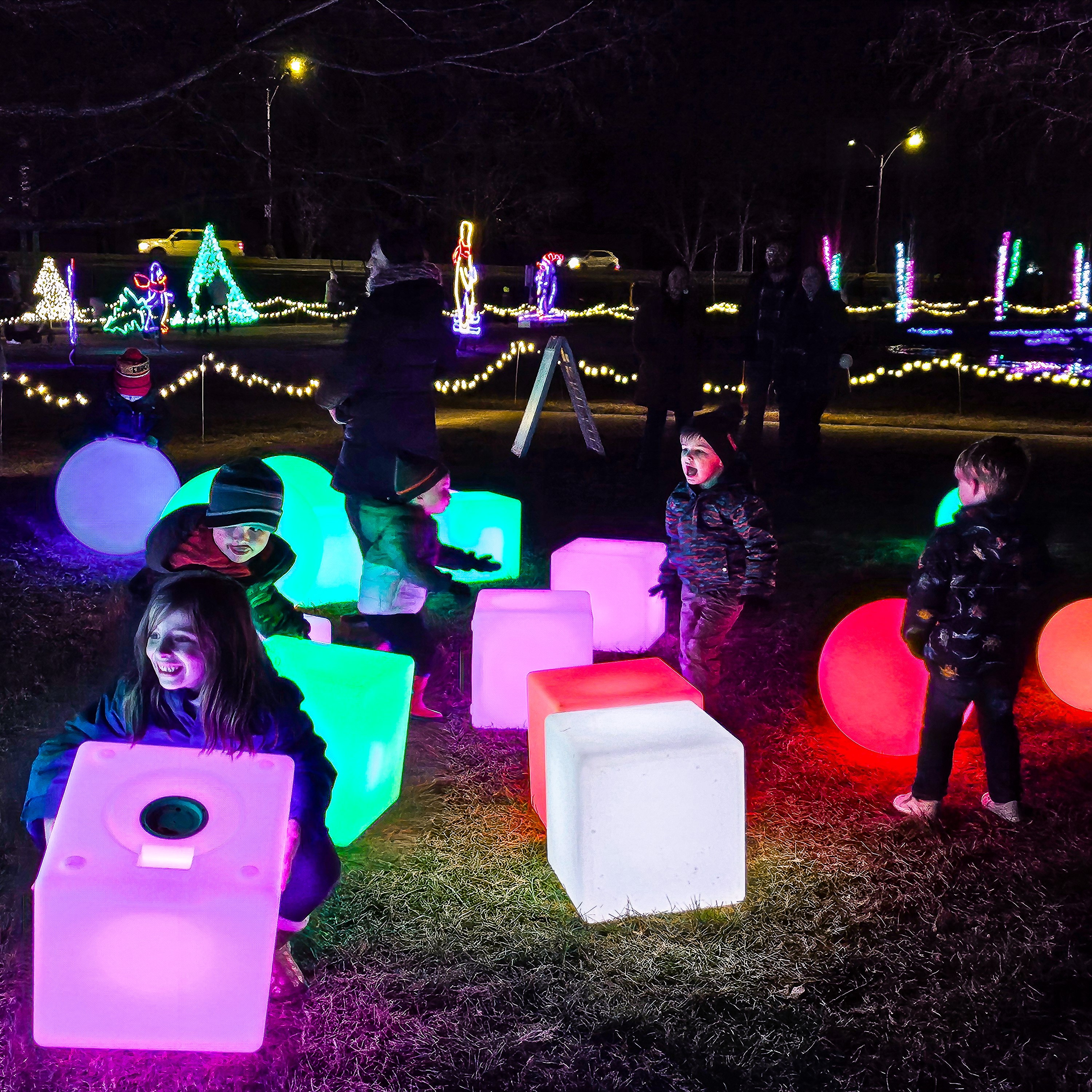 Children playing with lighted cubes and balls