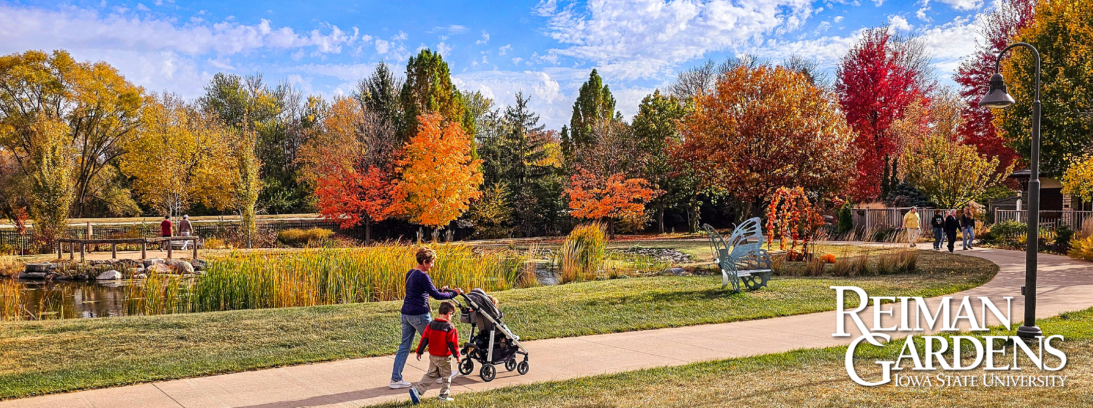 People enjoying a fall day at a public garden