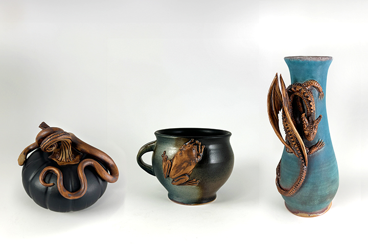 Handmade pottery adorned with creatures