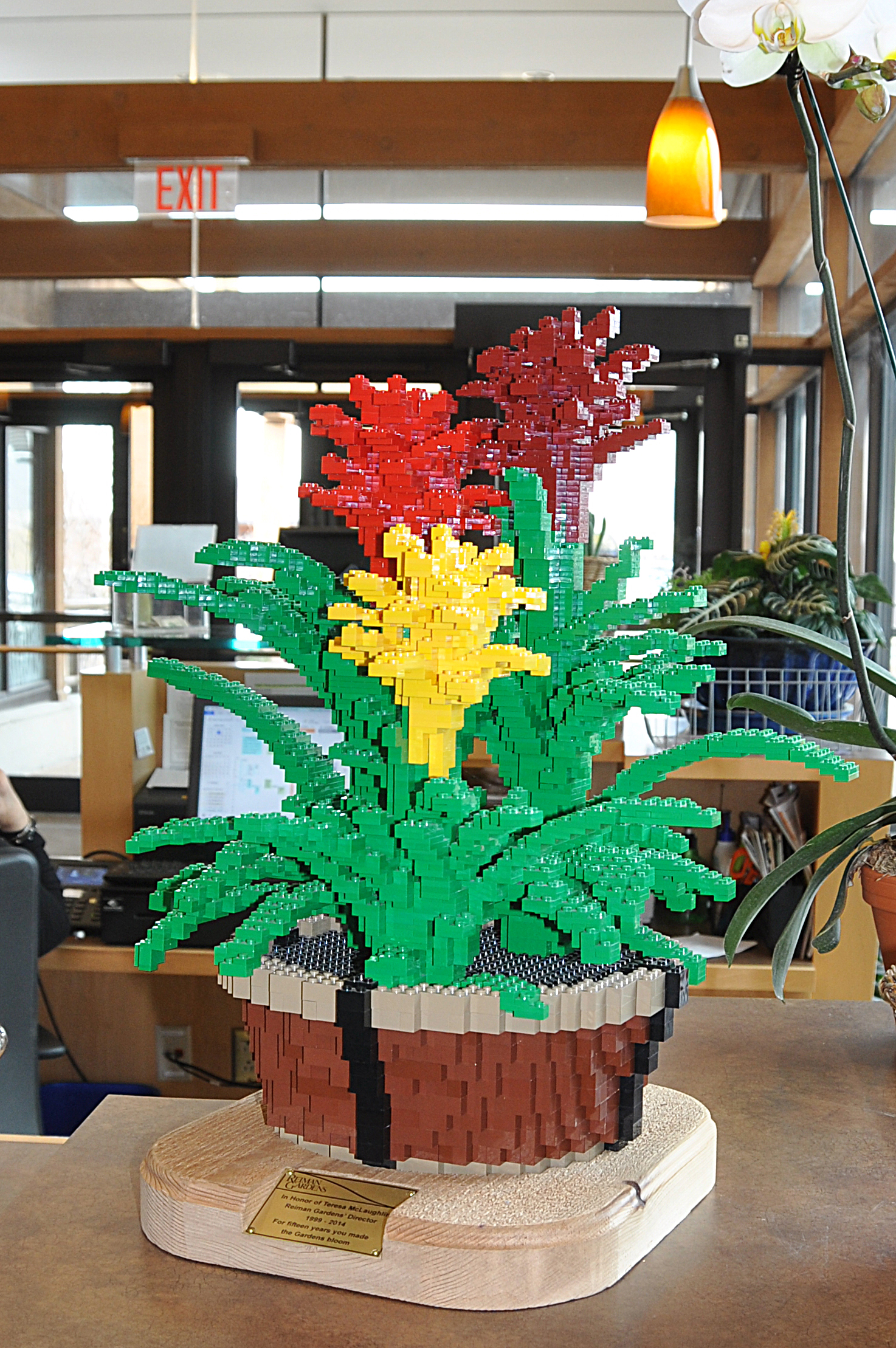a bromeliad made from LOGO(R) bricks inside a building