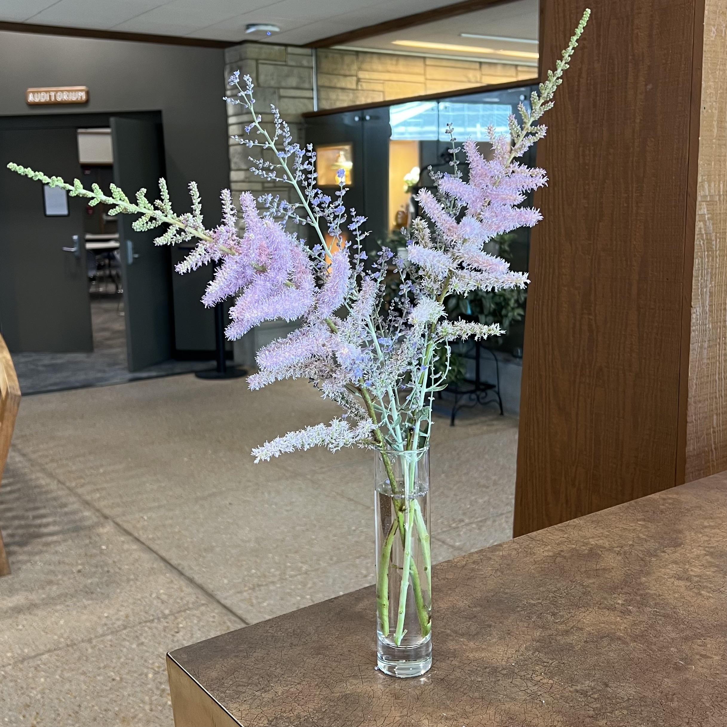 A bouquet with pink and purple flowers with an interesting form