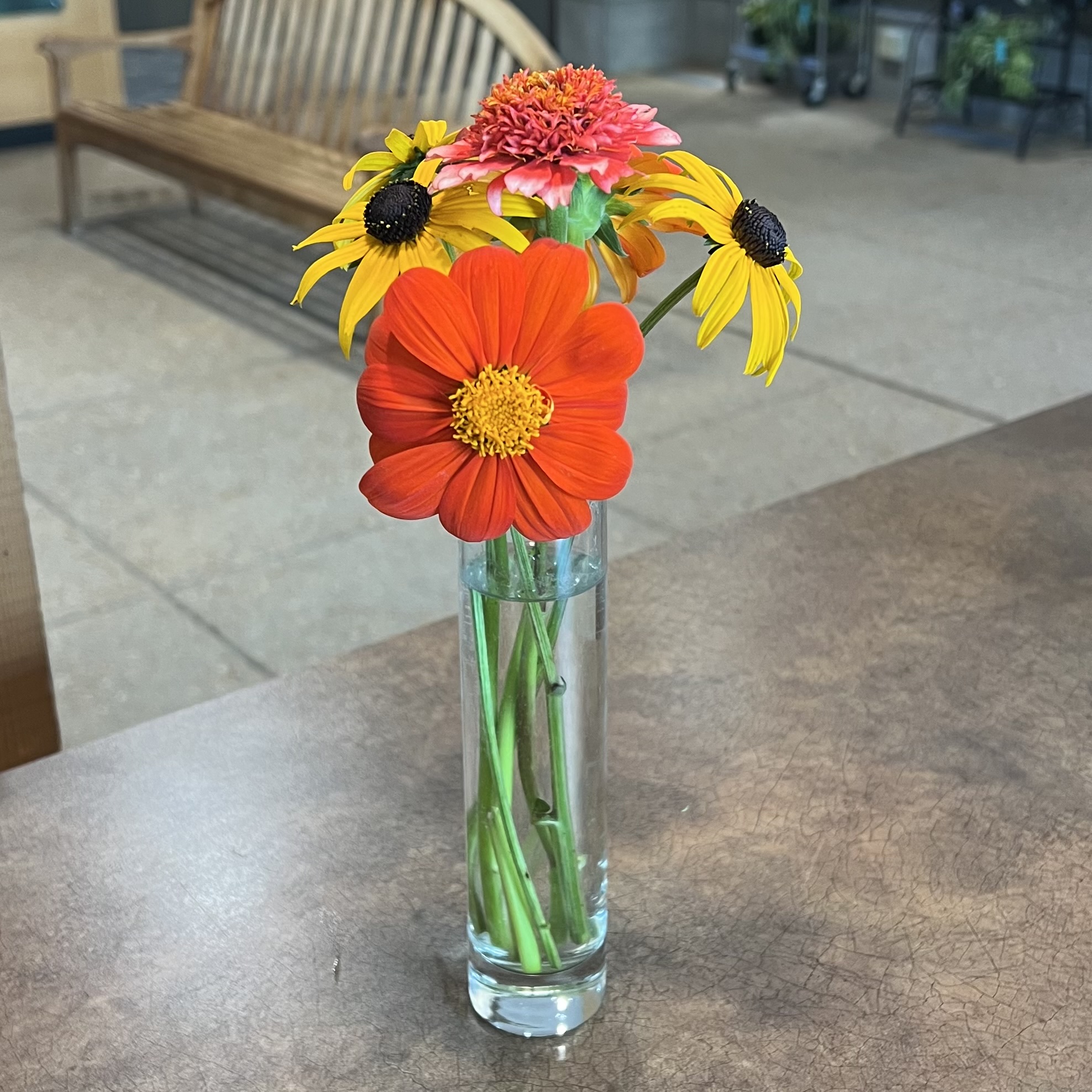 A small bouquet with warm-colored flowers