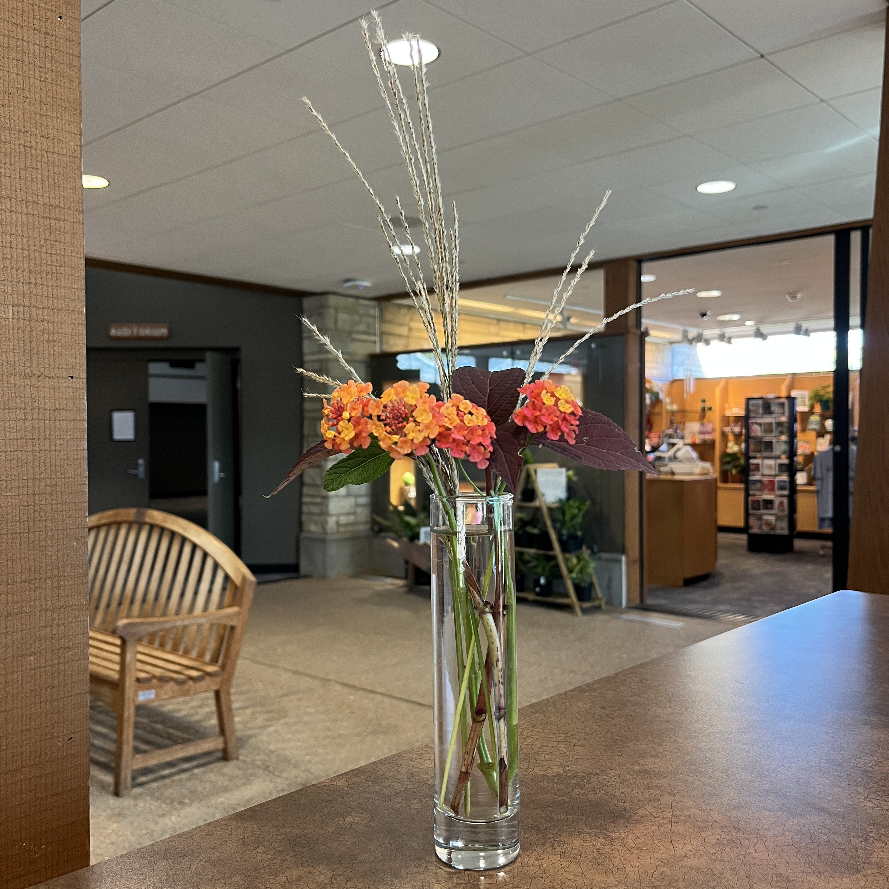 Bouquet with orange flowers and grasses.