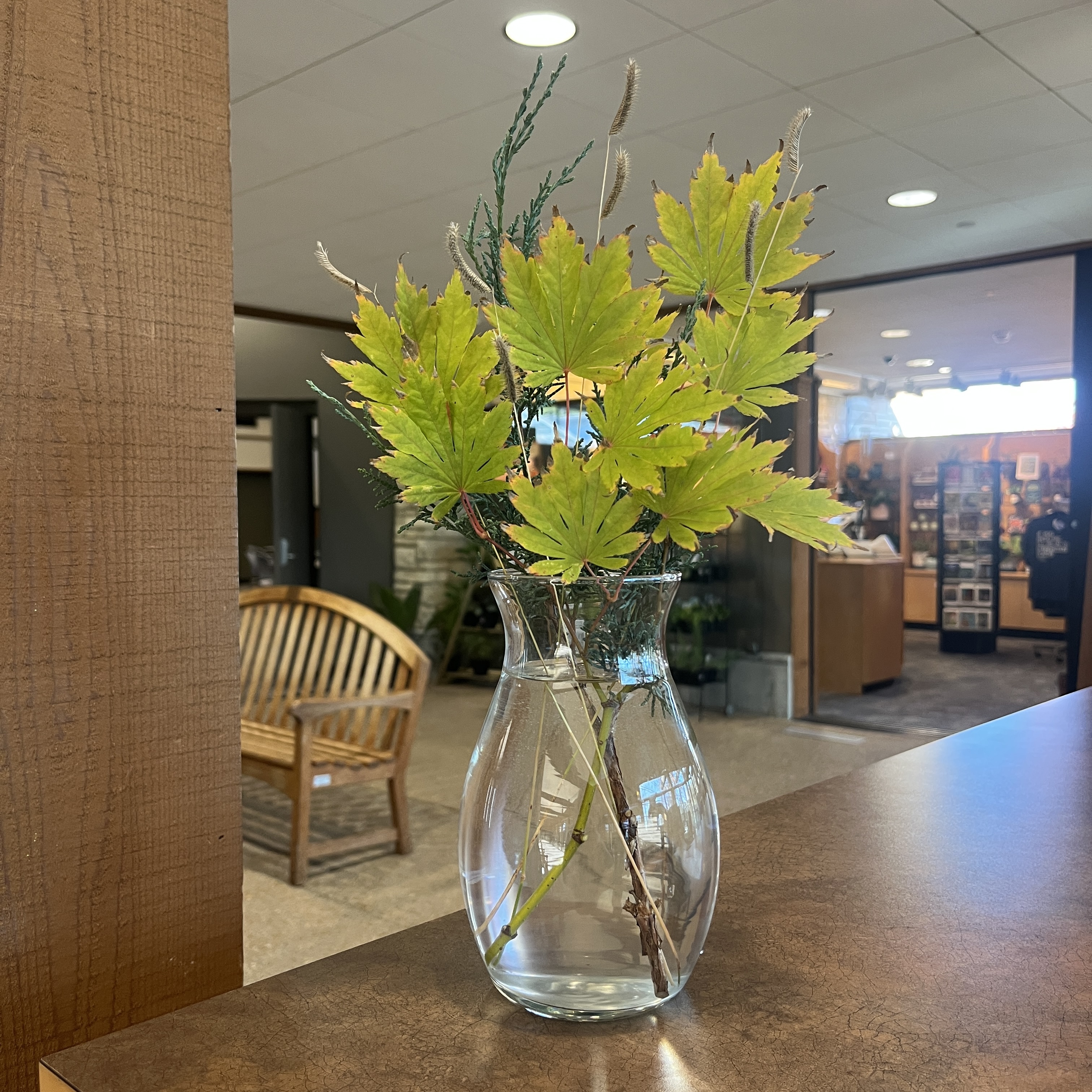 Bouquet with green leaves and grasses.