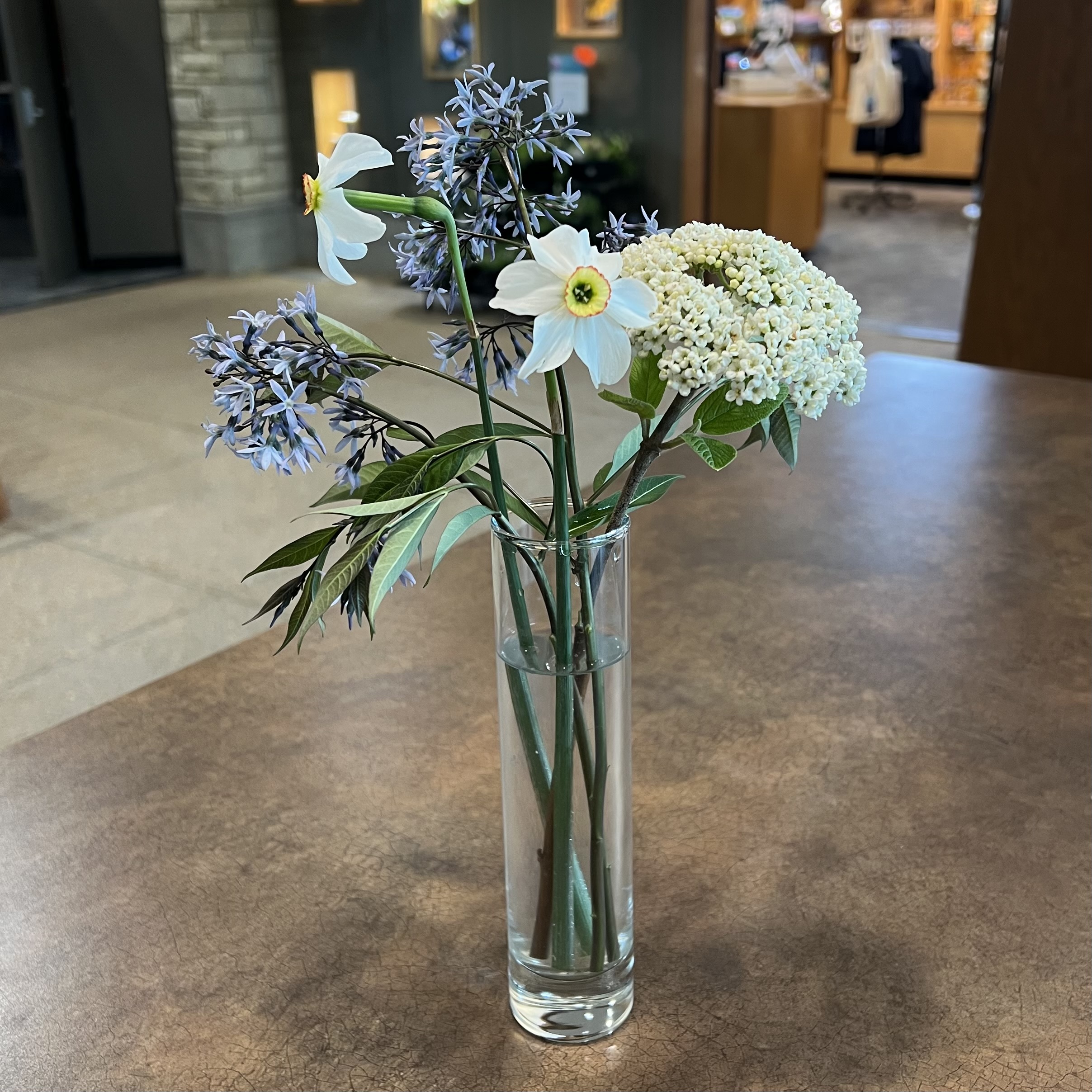 an arrangement of white and blue blooms