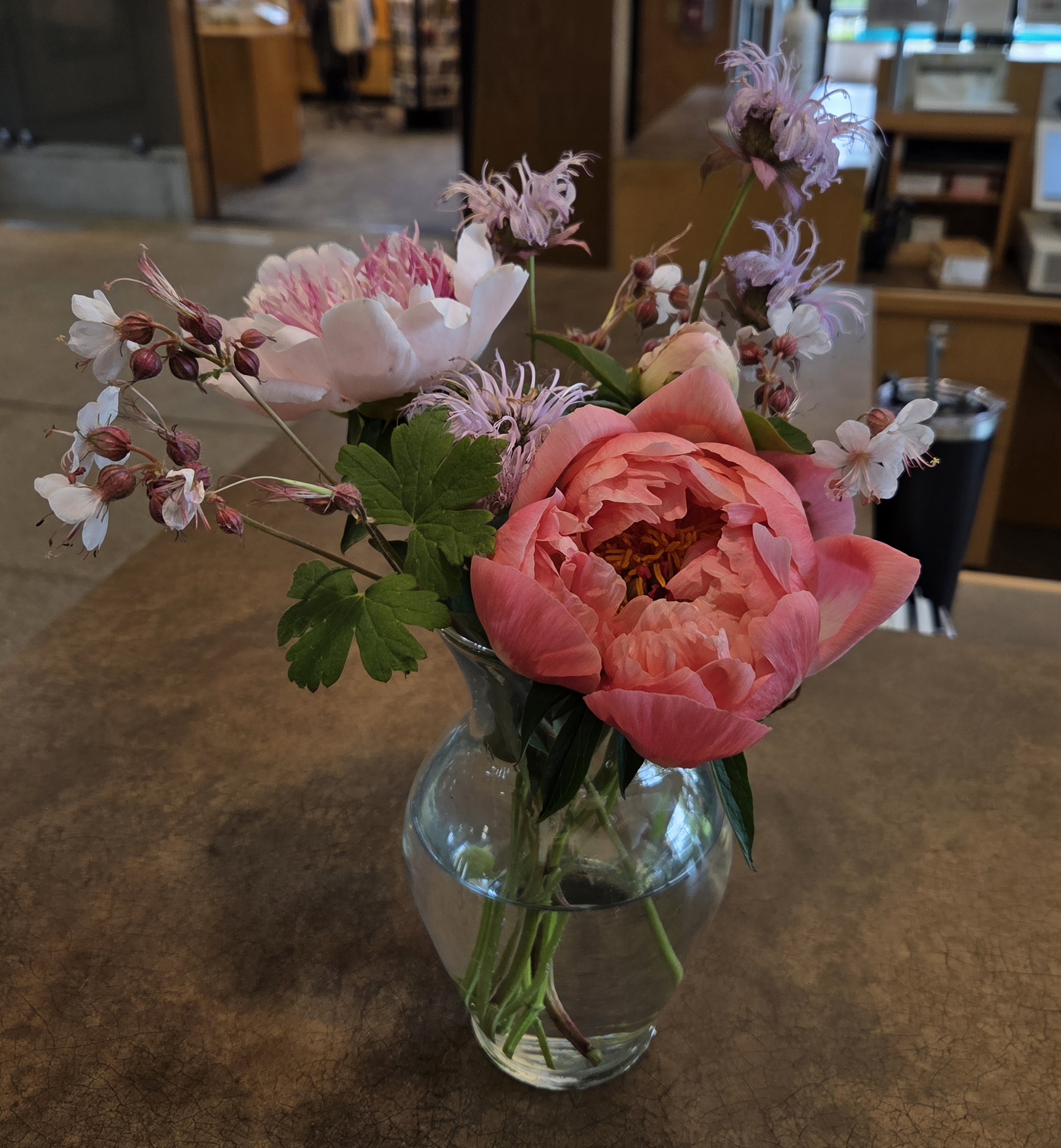 Arrangement of pink flowers; includes Peonies, Bee Balm, and Cranesbill