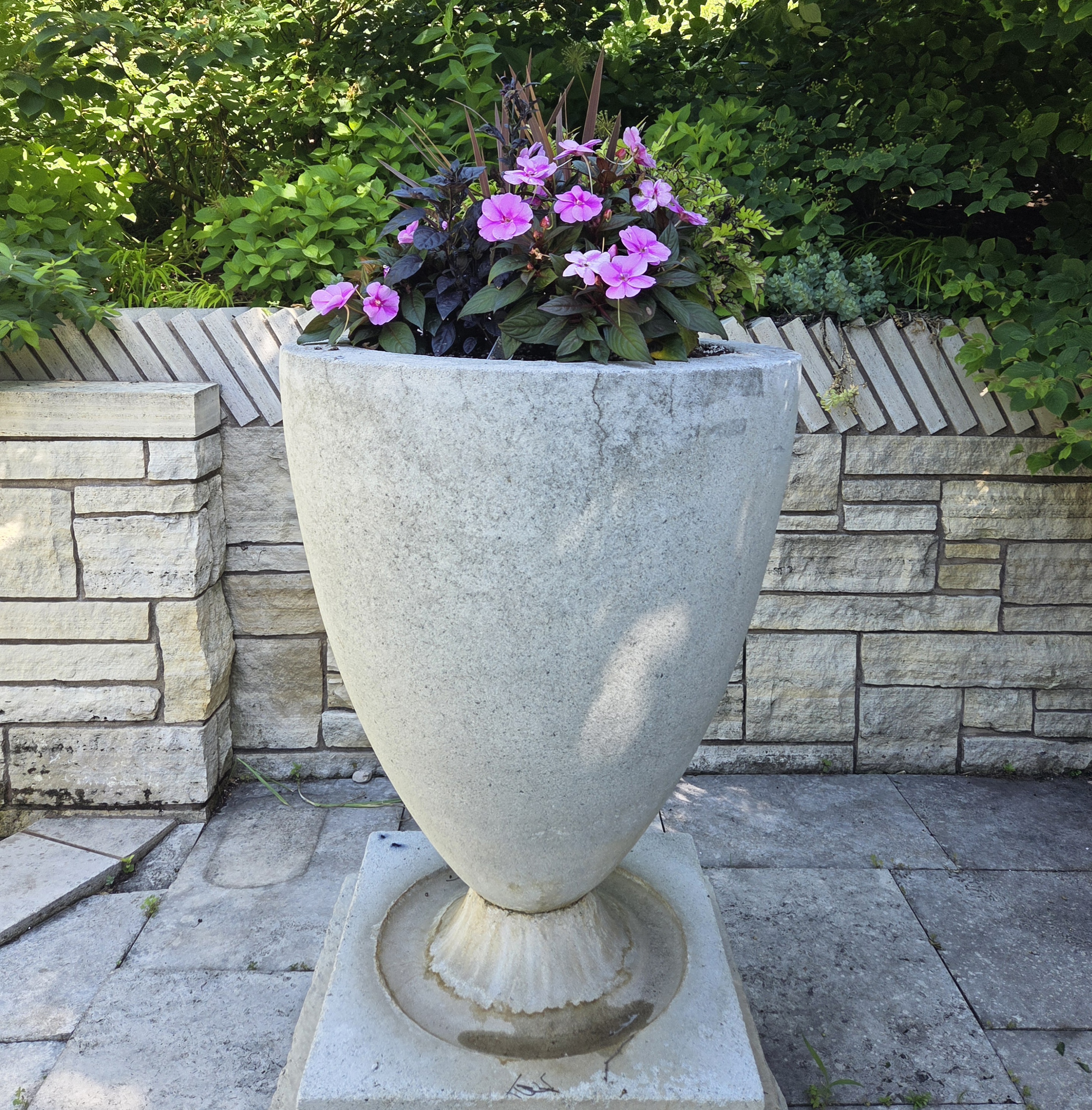 A large container with Impatiens, Ornamental Pepper, Coleus, and Cordyline