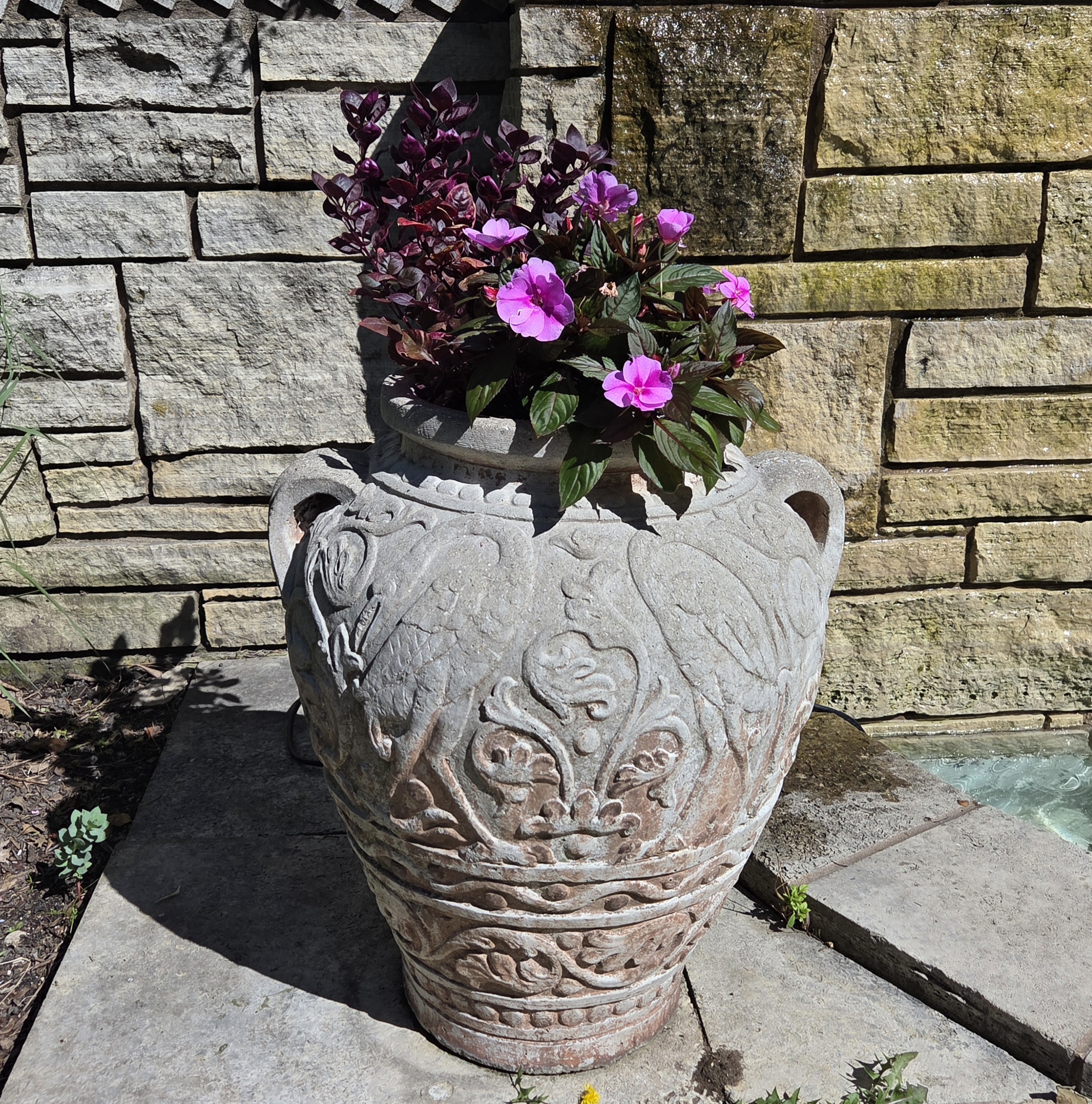 A small container with Impatiens and Alternanthera