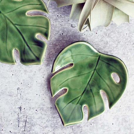 Clay platter in the shape of a monstera leaf