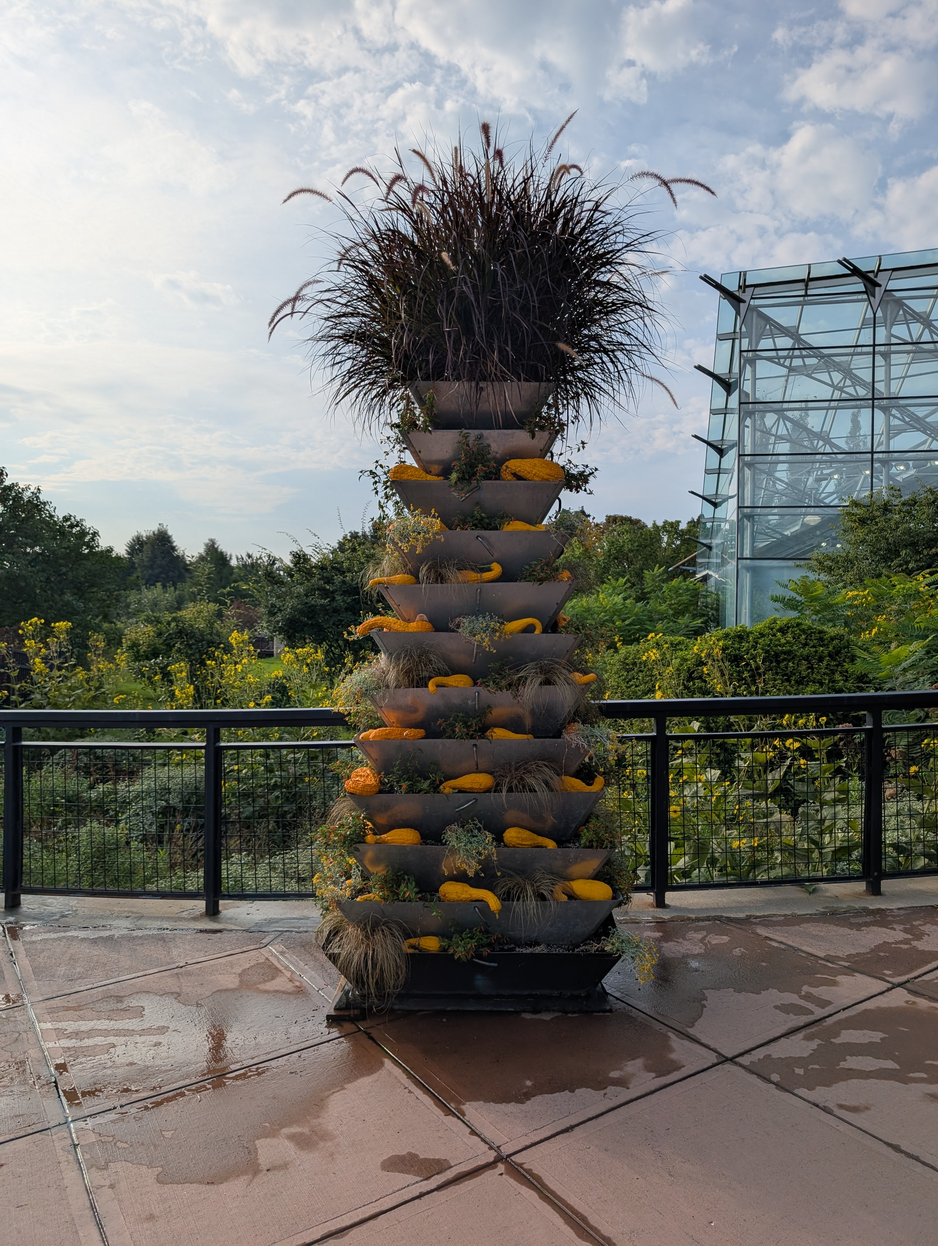 12-tier flower tower with fall annuals and decorative gourds