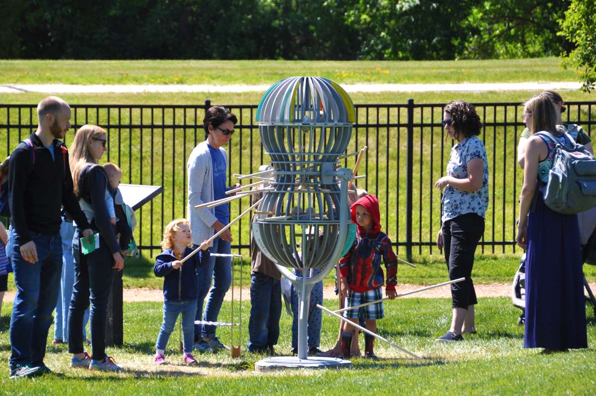 A group of people play with the Consequence game.