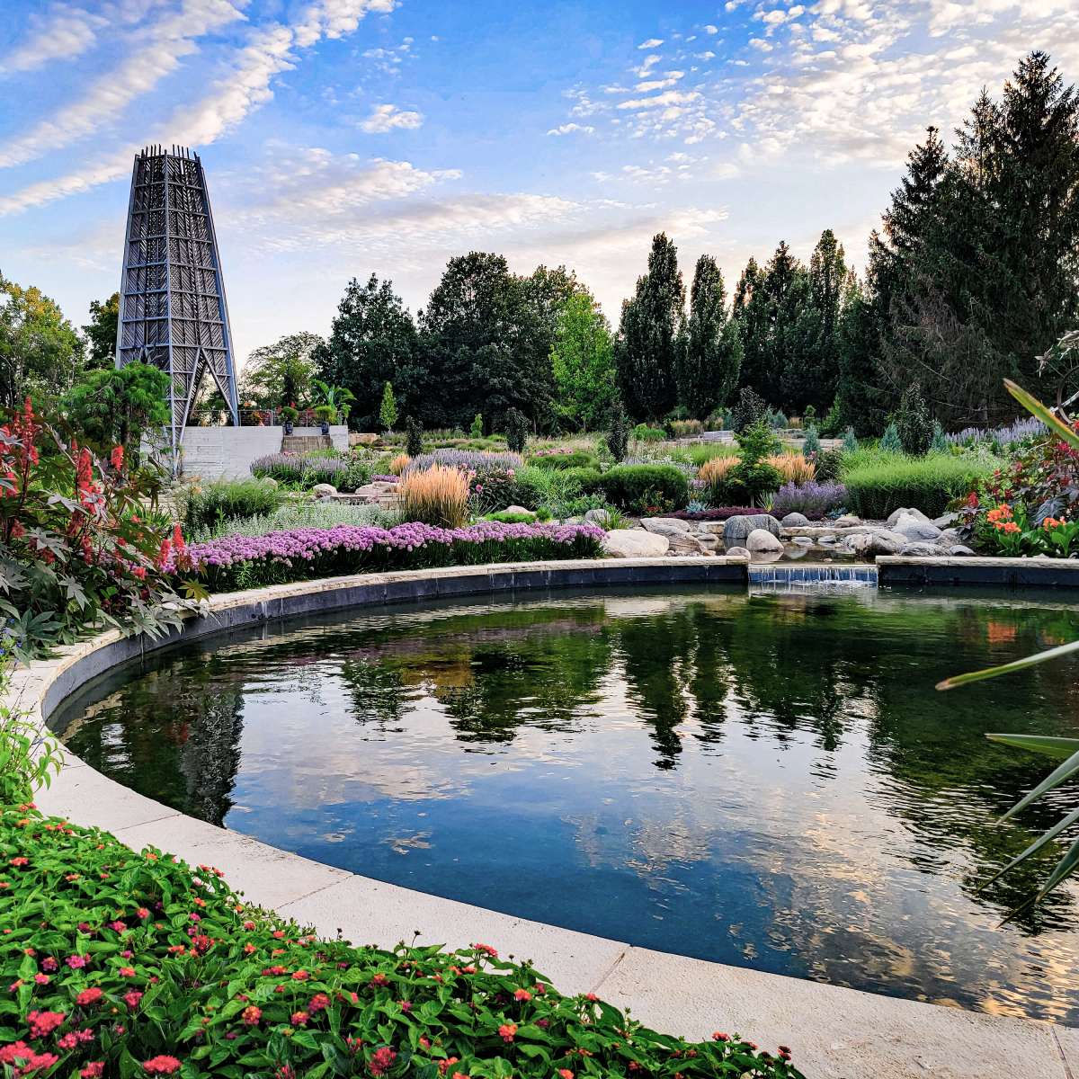 Colorful garden with tower and reflecting pool