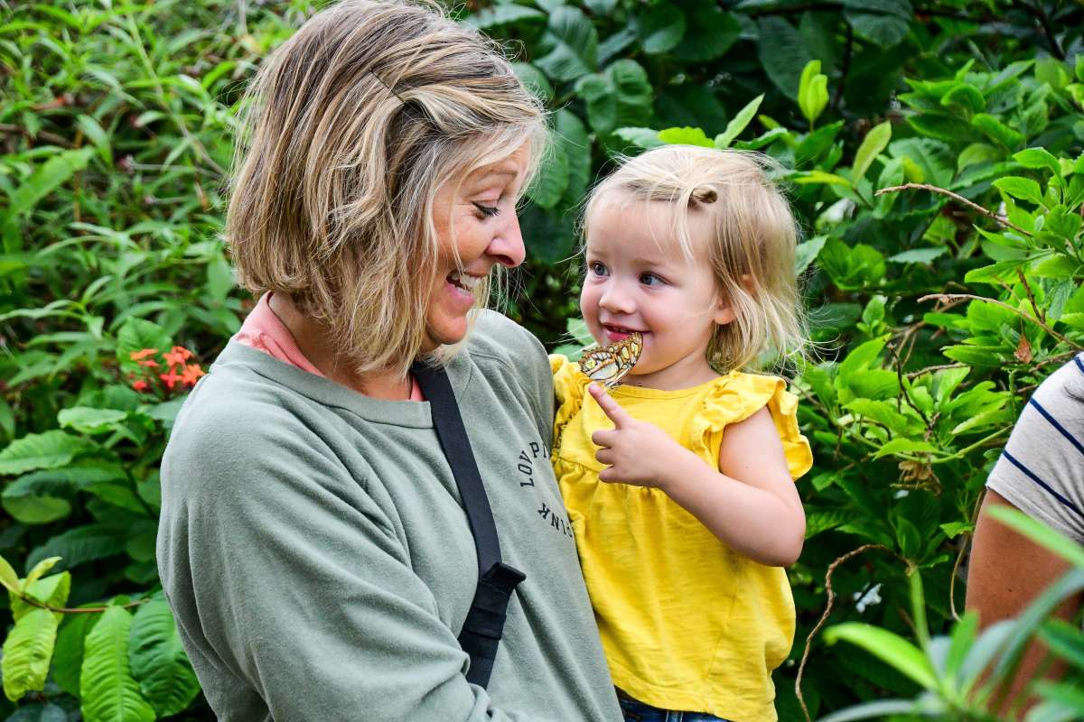 Girl and butterfly at Reiman Gardens