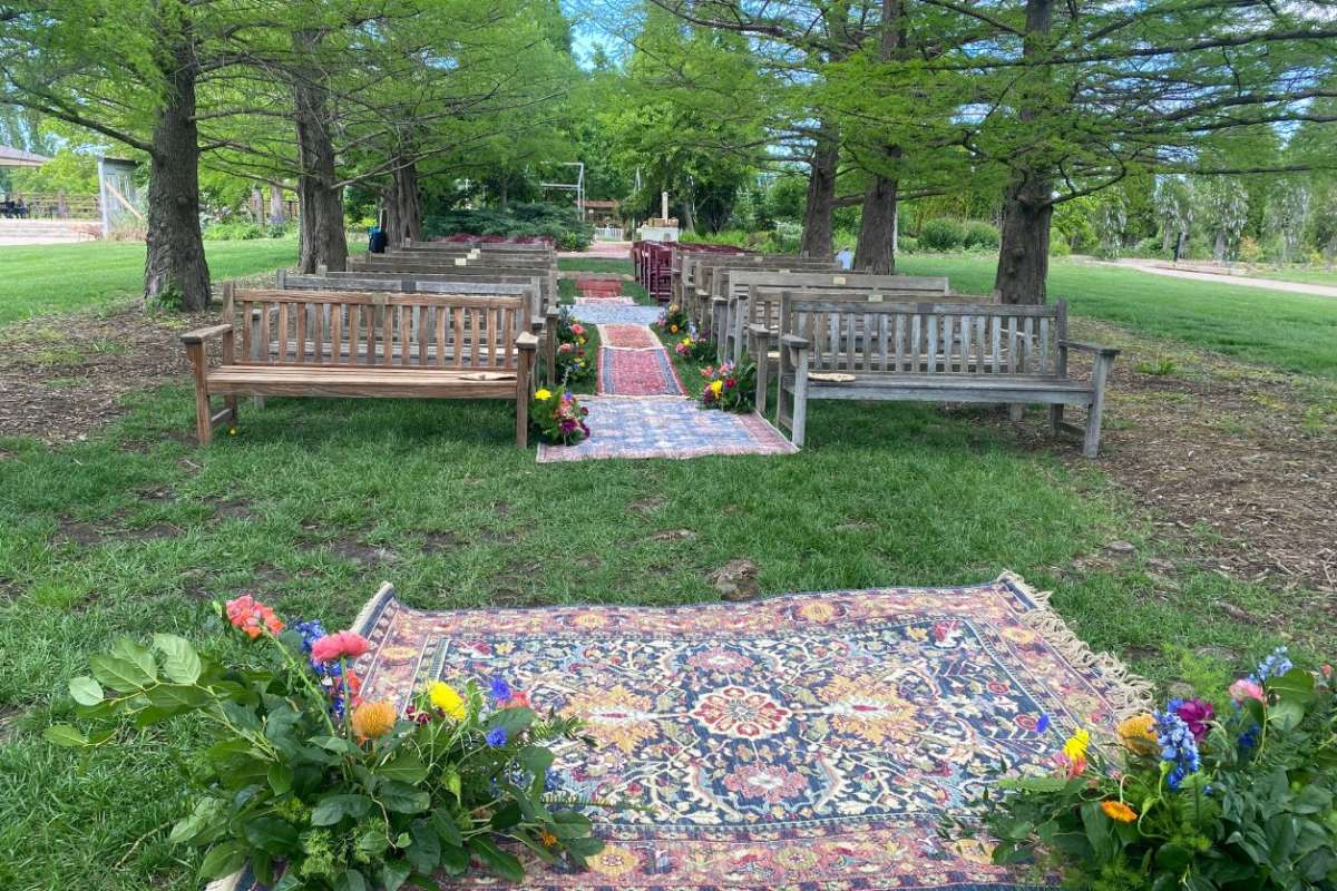 Top photo is from a wedding ceremony in Bald Cypress Allee. They utilized benches and red chairs for seating.