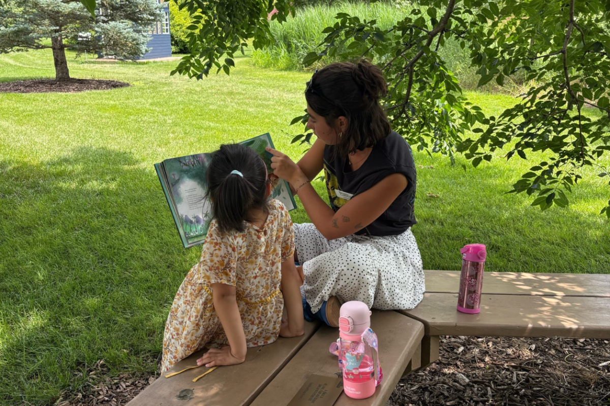 Reading books under the tree during bookworm camp