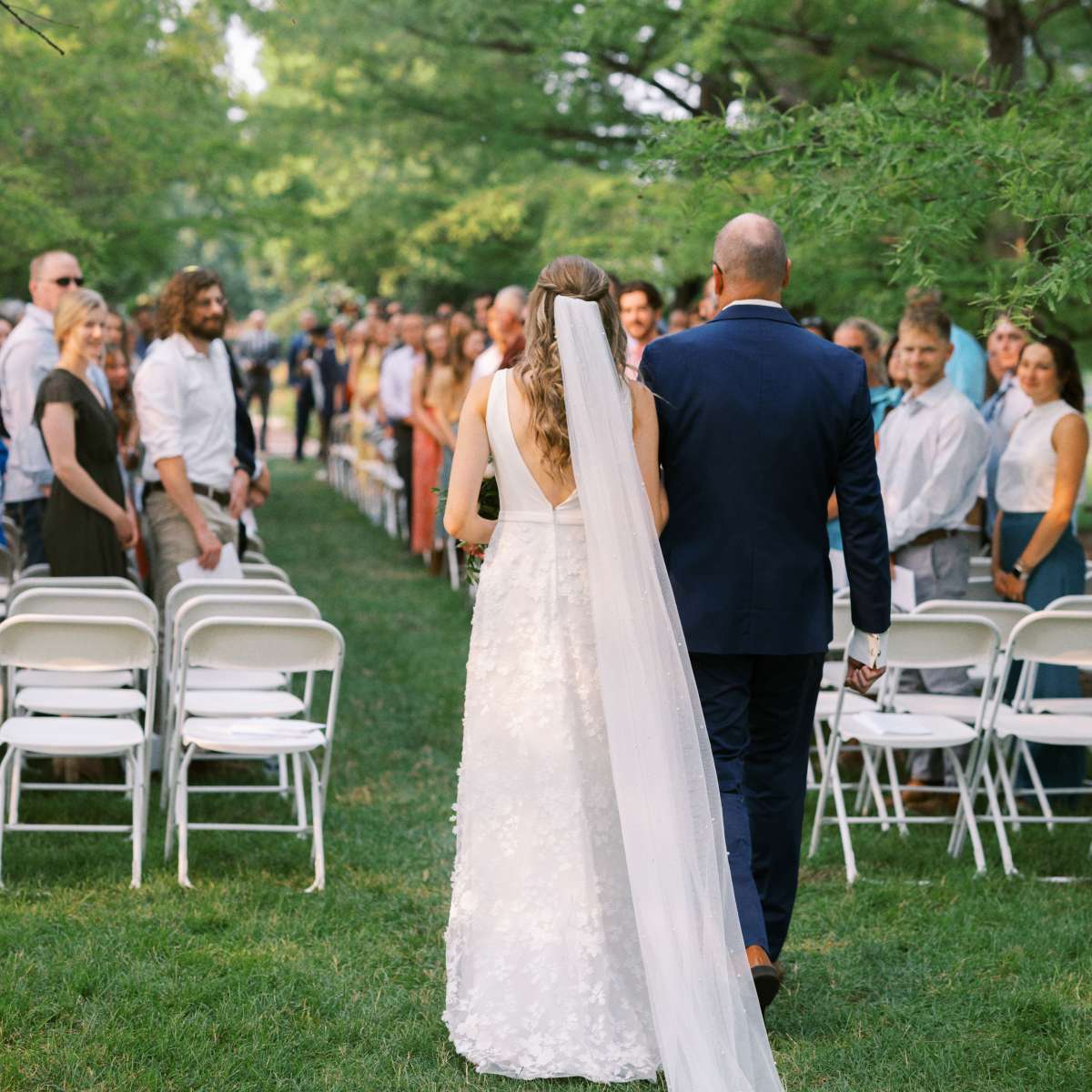 Bride and father walking down the aisle