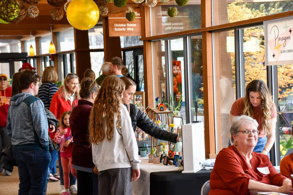 Shoppers browsing at an art fair