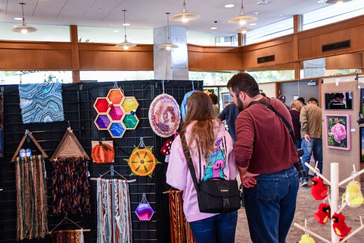 Shoppers browsing at an art fair