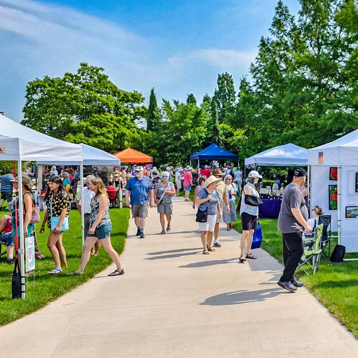 People shopping at an outdoor art fair