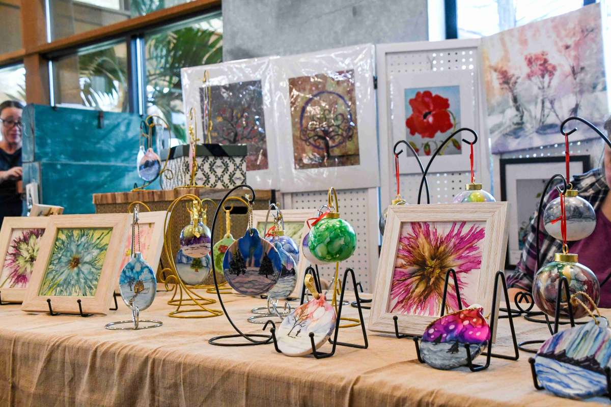 Artwork and ornaments on display for a craft fair