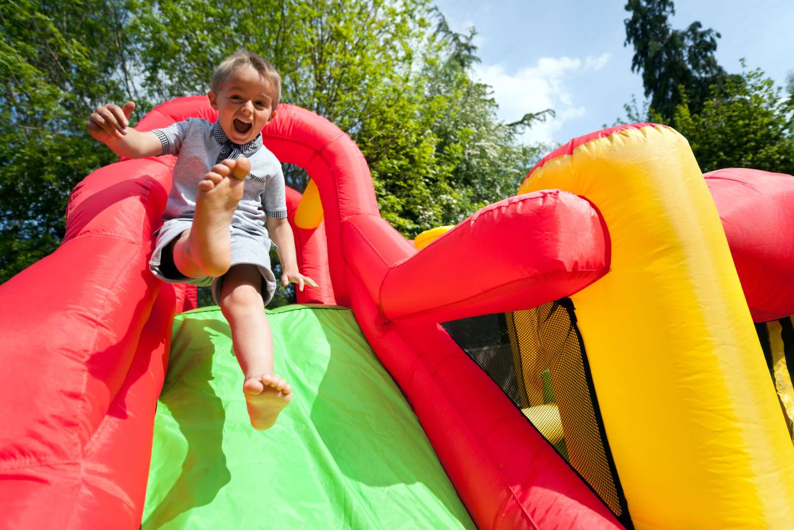 Boys on inflatable slide