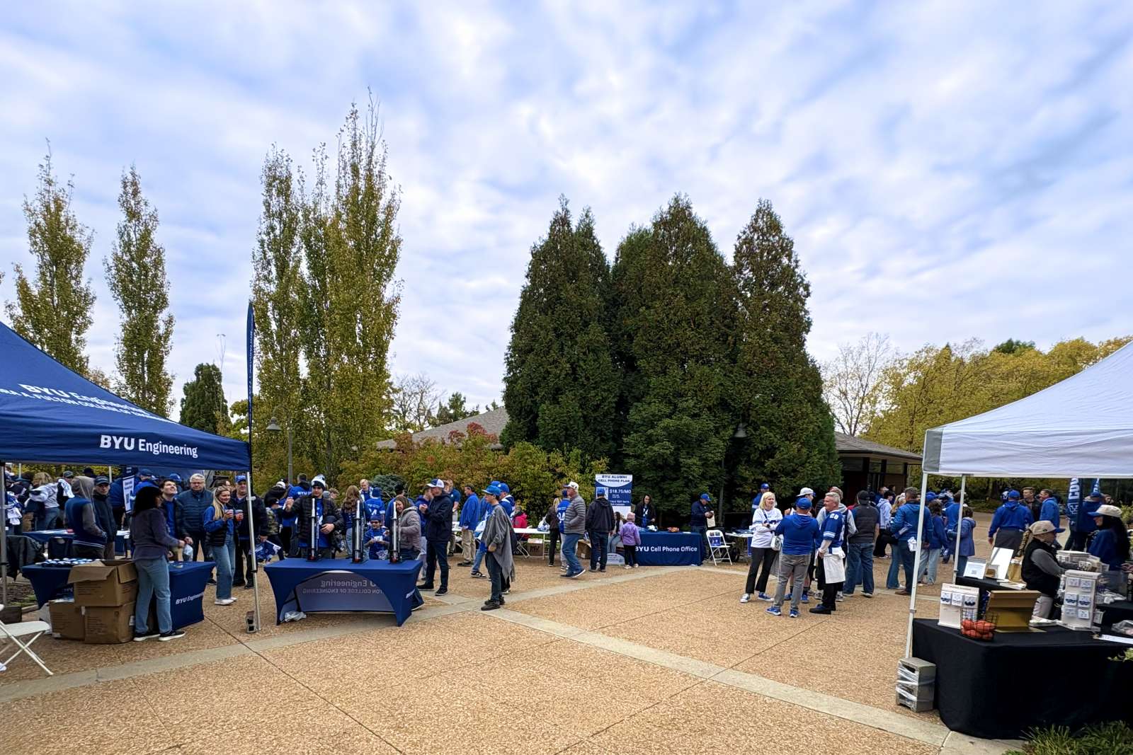 Football fans tailgating at a public garden