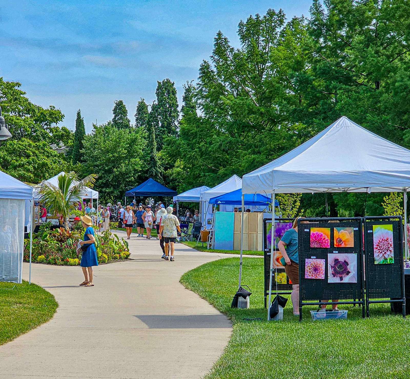 People shopping at an art fair in a park