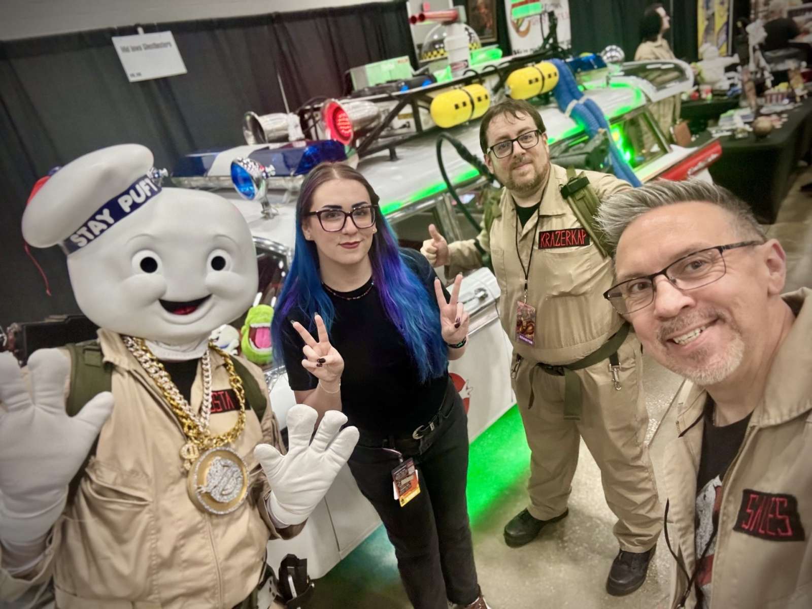 Men and women dressed as characters form the Ghostbusters movie.