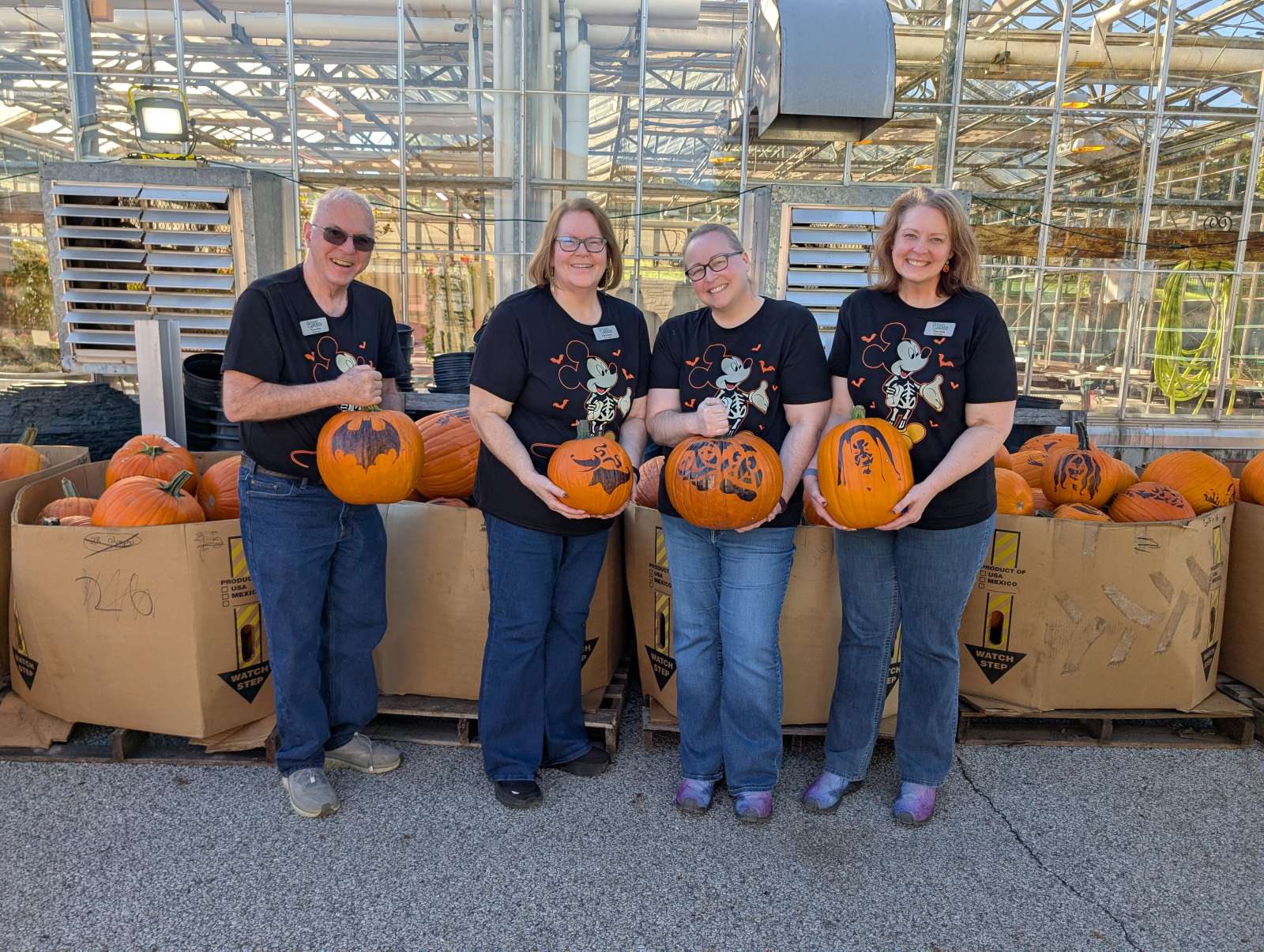 The Buchholz family holding pumpkins.